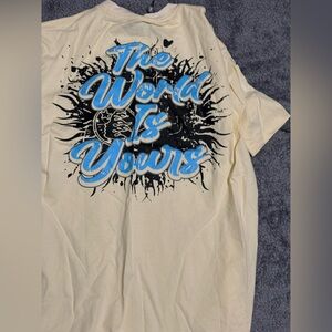 Cream Graphic Tee with Blue and Black Design